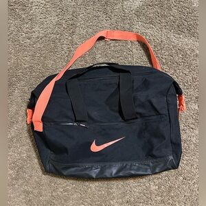 Vintage Nike sportswear “triple black & orange T90” duffel bag 00s